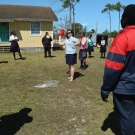 Amy Heemsoth, Director of Education helps the students throw the yarn to a student. The yarn representst the energy that is being passed from organism to organism.