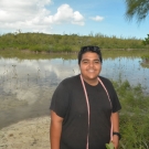 B.A.M. year 2 student from Forest Heights Academy is ready to identify and measure the mangrove trees in his group's quadrat.