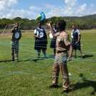 Students use yarn to create a mangrove food web or a series of interconnected food chains.