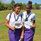 William Knibb students show off the food web animals that they represent.