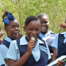 Students taste a mangrove leaf -they're salty!