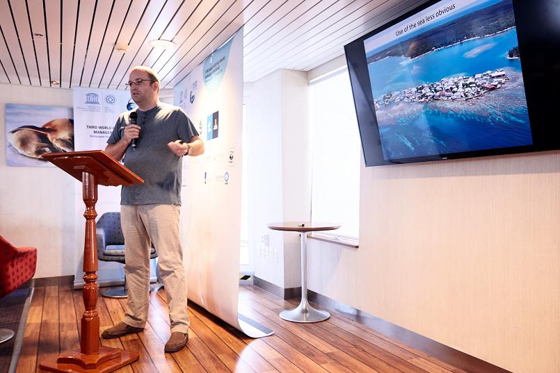 Dr. Stephen Box presents his work on working with fishing communities. (© Andreas Krueger/UNESCO)