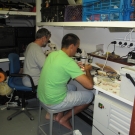 Thomas Cribb and Pierre Sasal work on the lab aboard the Golden Shadow.