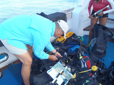 Dave Grenda and Krista Sherman with their SCUBA gear and survey equipment. Dave Grenda and Krista Sherman with their SCUBA gear and survey equipment.
