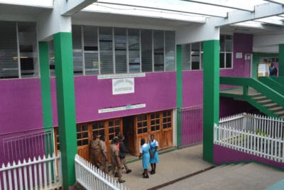 Students at William Knibb High School socializing in the hallways.
